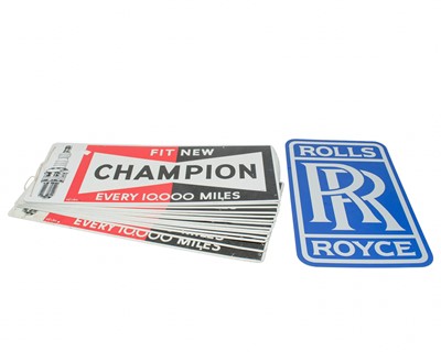 Lot 16 - A group of 14 Champion spark plug tin advertising signs.