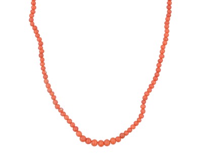 Lot 265 - A coral graduated bead necklace fitted with a high-purity gold clasp.