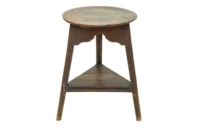 Lot 684 - An ash and elm circular cricket table.