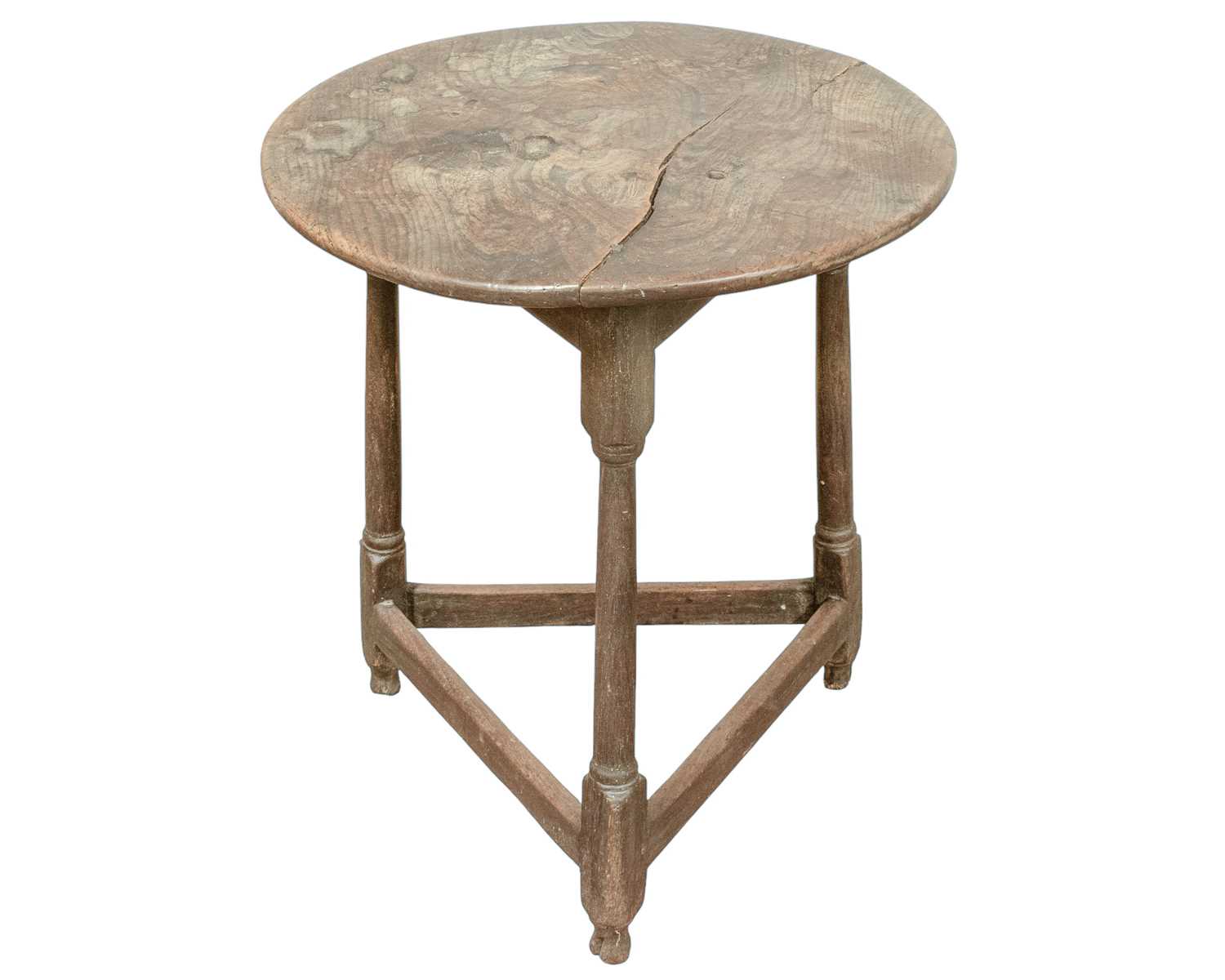 Lot 666 - An elm and oak circular cricket table.
