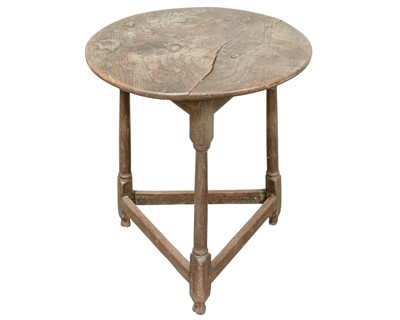 Lot 666 - An elm and oak circular cricket table.