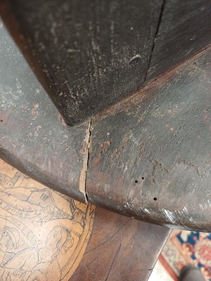 Lot 666 - An elm and oak circular cricket table.