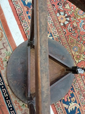 Lot 666 - An elm and oak circular cricket table.