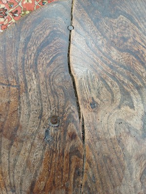 Lot 666 - An elm and oak circular cricket table.