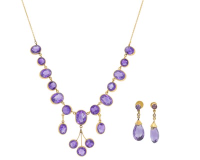 Lot 262 - An 18k collet set amethyst necklace, with a pair of 9k amethyst pendant earrings.