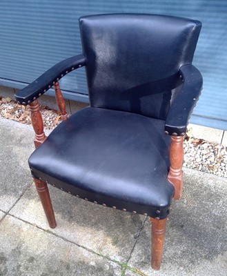 Lot 24 - A Leather Upholstered Arm Chair.