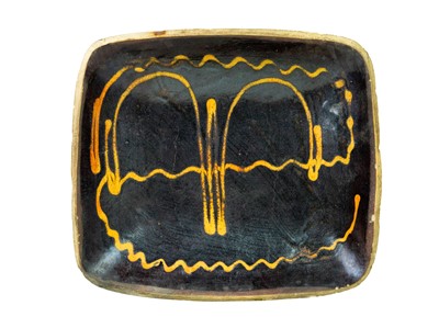 Lot 612 - A slipware rectangular dish.