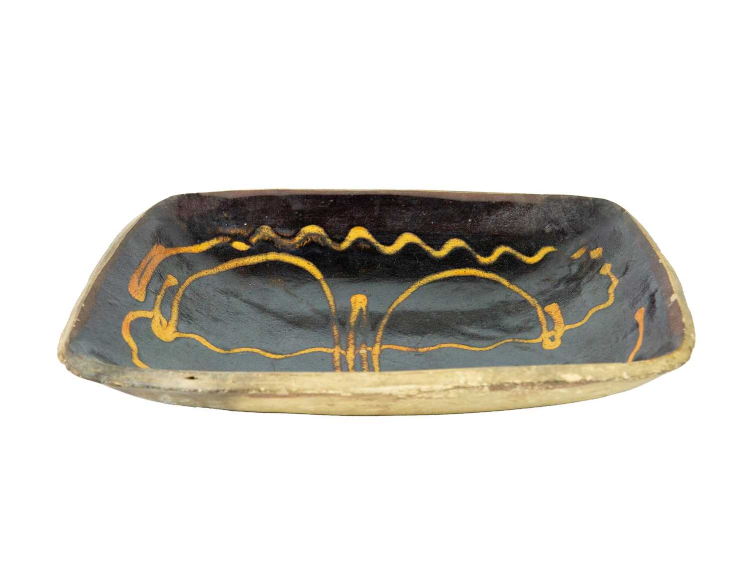 Lot 612 - A slipware rectangular dish.