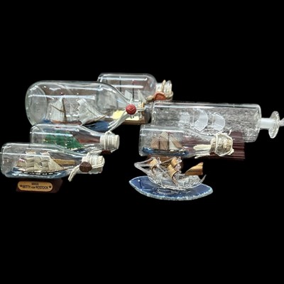 Lot 79 - Six ships in bottles, the largest is 22cm long...