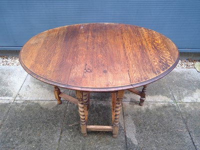 Lot 51 - An Oak Drop-Leaf Table. With Barley Twist Legs,...