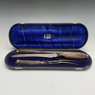Lot 159 - A cased three piece carving set with stag horn...