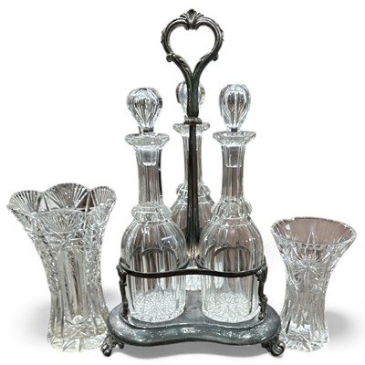 Lot 71 - A silver-plated decanter holder and three cut...