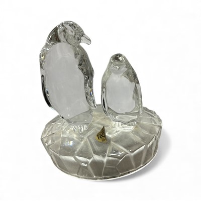 Lot 74 - A lead crystal penguin and baby by RCR (Royal...