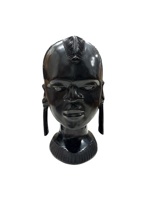 Lot 31 - A heavy African carved bust of a tribal woman,...