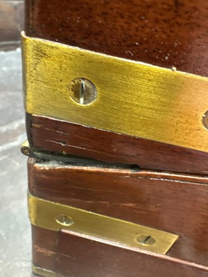 Lot 24 - A 19th century mahogany and brass bound writing slope.