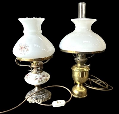 Lot 49 - Two converted oil lamps, the taller one is...