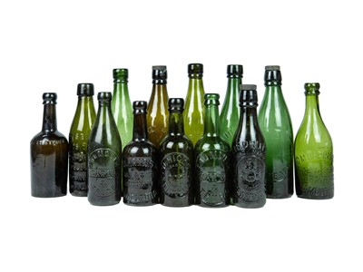 Lot 754 - A collection of local interest (Cornish) green glass bottles.