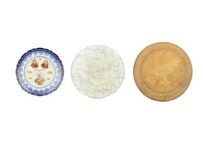 Lot 344 - A carved wood bread board.