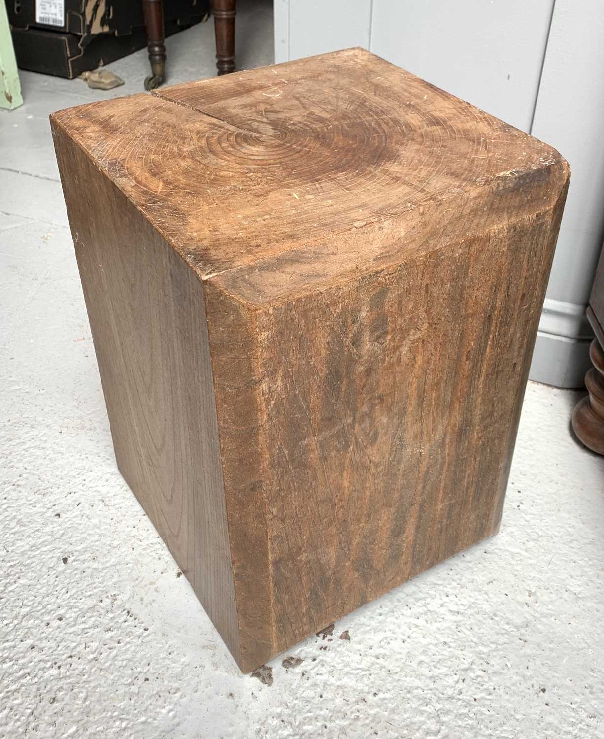 Lot 29 - A square chunk of chestnut timber. Height 44cm,...