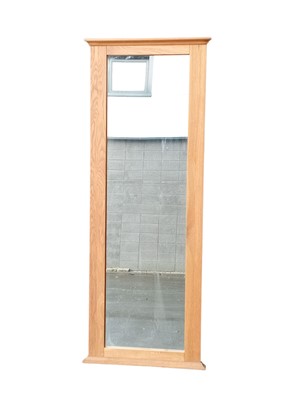 Lot 45 - A large, Blonde oak-framed wall mirror. 69 x...