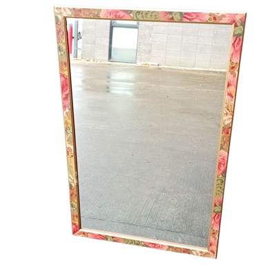 Lot 103 - A wooden-framed wall mirror decorated with a...