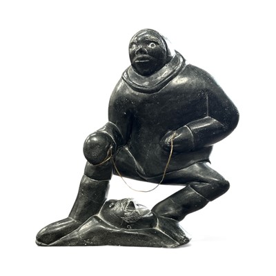 Lot 41 - A vintage Inuit soapstone carving of a hunter,...