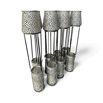 Lot 131 - Eight Metal Planters / Candle Holders. The...