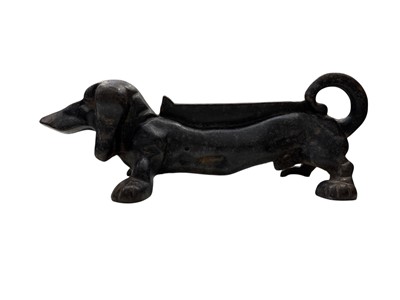 Lot 115 - A cast iron boot scraper in the form of a...