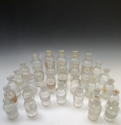 Lot 278 - A collection of 36 apothecaries glass jars and...