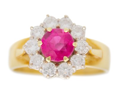 Lot 200A - An 18k gold, synthetic ruby, and diamond cluster ring.