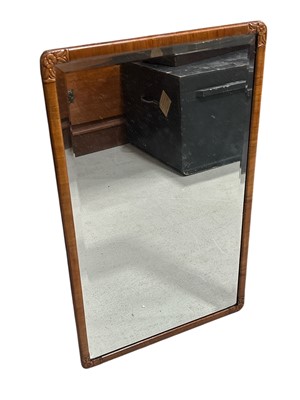 Lot 204 - A vintage bevel-edged mirror with a carved...
