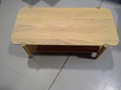 Lot 11 - A Blonde Oak Coffee Table. The Table is 41cm...