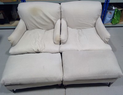 Lot 22 - Two OKA Chairs and Footstools. The Chairs are...