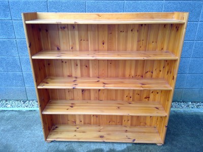 Lot 34 - A Pine Closed-Back Bookcase. The measurements...