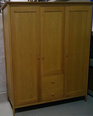 Lot 9 - A Modern Ercol Wardrobe. The Wardrobe is 195cm...