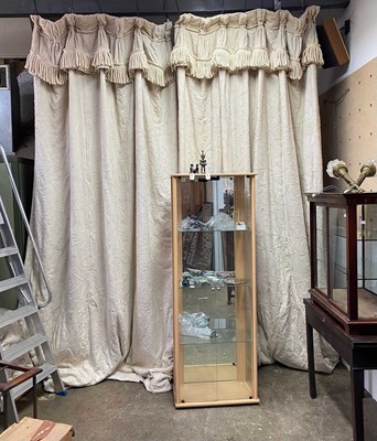 Lot 589 - A pair of interlined cream crewelwork curtains.