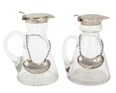 Lot 192 - Two silver mounted cut glass whisky noggins.