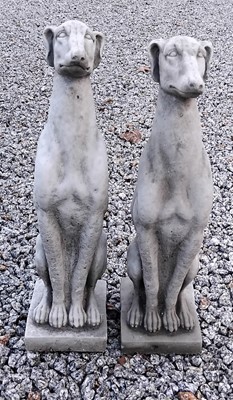 Lot 882 - A pair of reconstituted stone whippets.
