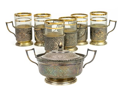 Lot 420 - A Persian silver sugar bowl and cover, and six cups.