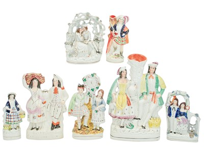 Lot 653 - Seven Victorian Staffordshire figures and groups.