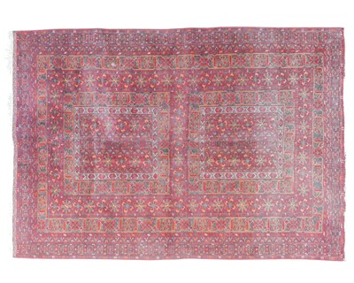 Lot 456 - An Afghan wool carpet.