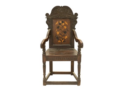 Lot 795 - A joined oak and marquetry inlaid wainscot armchair.