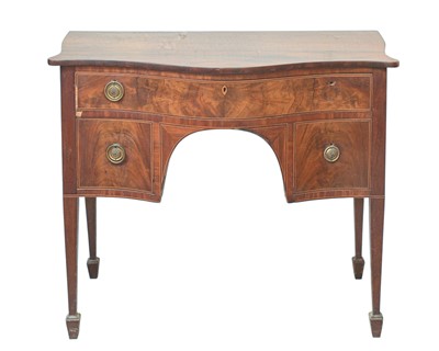 Lot 903 - A George III mahogany serpentine fronted sideboard.