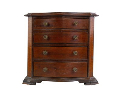 Lot 95 - A 19th century mahogany, inlaid and crossbanded serpentine front miniature chest.