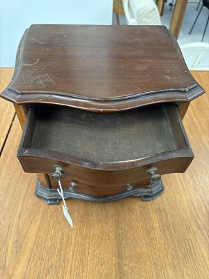 Lot 95 - A 19th century mahogany, inlaid and crossbanded serpentine front miniature chest.