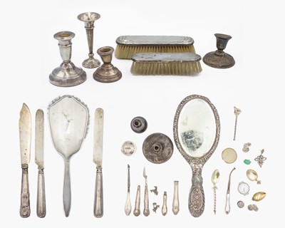 Lot 206 - A collection of scrap weighted or mounted silver items.