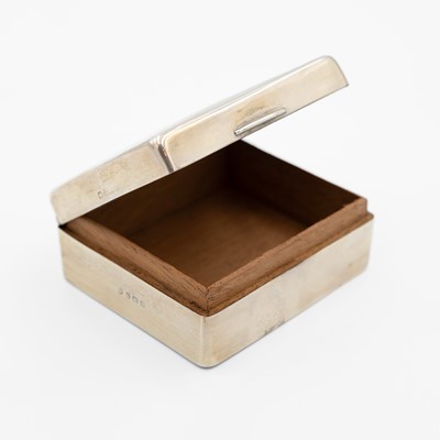 Lot 208 - A George VI silver engine turned small cigarette box.