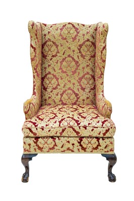 Lot 939 - A George III style mahogany wing armchair.