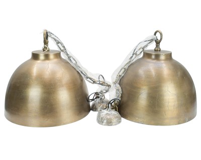 Lot 813 - A pair of bronze designer ceiling pendant lights.