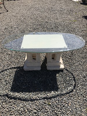 Lot 142 - A Mactan Stone coffee table with glass top....